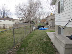 Fenced backyard featuring a patio