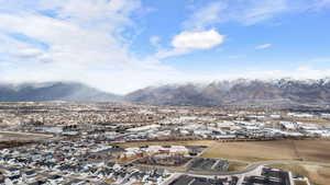 View of mountain backdrop featuring nearby suburban area