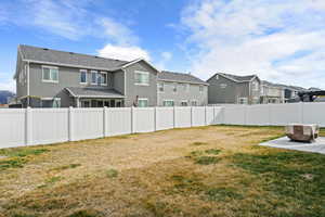 Fenced backyard with a residential view