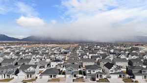 View of city featuring nearby suburban area and a mountain backdrop