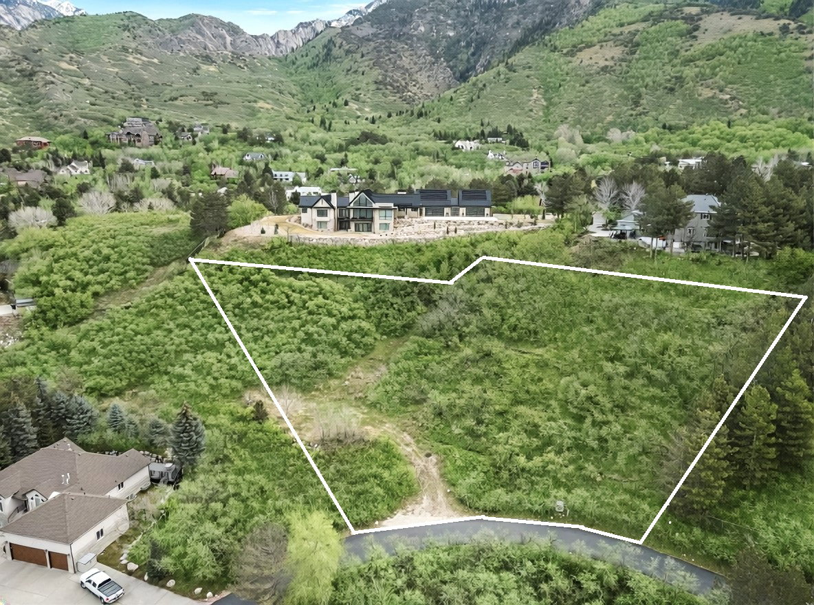 Aerial overview of property's location featuring mountains and property parcel outlined