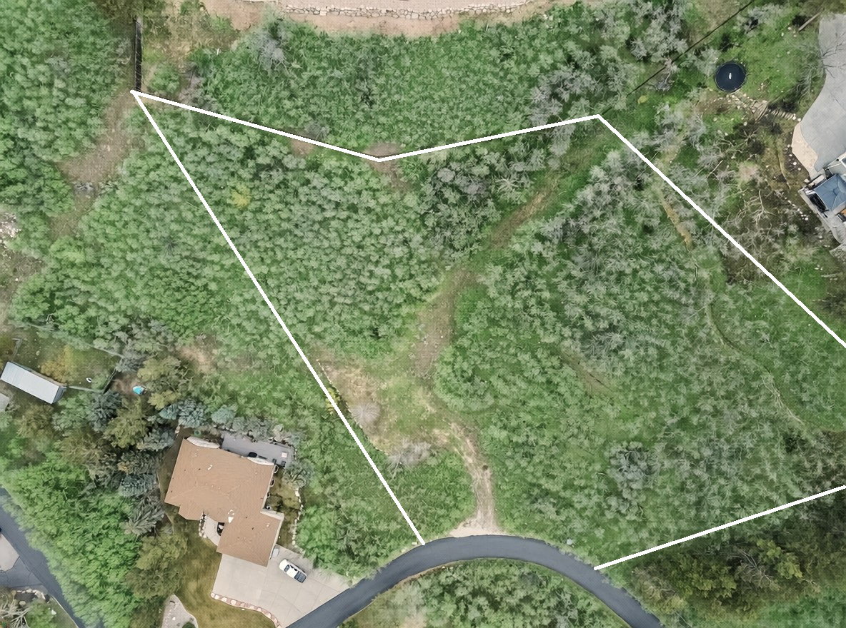 Aerial overview of property's location with property parcel outlined