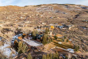 Aerial view of property and surrounding area with mountains and rural landscape