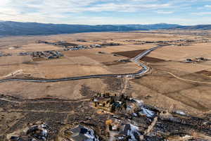 Aerial overview of property's location featuring rural landscape and mountains