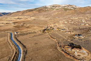 Overview of rural landscape with a mountainous background and a desert landscape