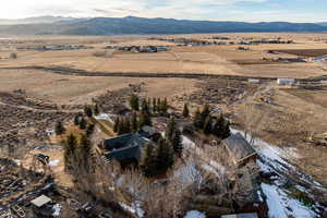 Aerial overview of property's location with mountains and rural landscape