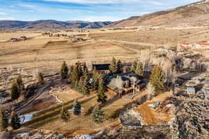 Overview of rural landscape featuring a mountainous background