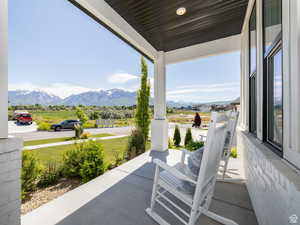 Covered porch with a mountain view