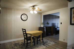 Informal dining space featuring a ceiling fan, a textured ceiling, and LVP floors.