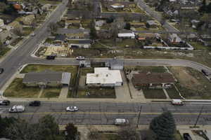 Aerial overview of property's location featuring nearby suburban area
