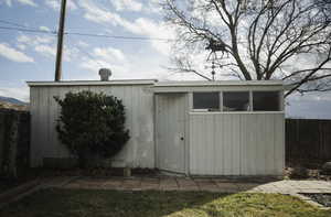 View of shed featuring a fenced backyard