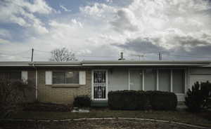 Ranch-style house featuring brick masonry and aluminum siding
