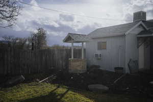 View of shed and fully fenced yard.