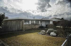 View of front of property with brick masonry and aluminum siding.