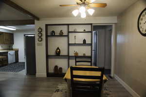 Informal dining room featuring LVP floors, ceiling fan, and a textured ceiling