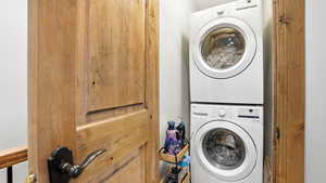 Laundry room featuring stacked washer / dryer
