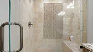 Bathroom featuring a shower stall and vanity