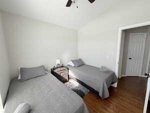 Bedroom featuring wood finished floors, lofted ceiling, and a ceiling fan (3rd Bedroom)