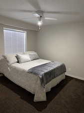 Bedroom featuring dark carpet and ceiling fan (4th Bedroom)