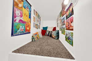 Kids club house in cubby above stairs (or extra storage)