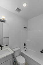 Bathroom with shower / washtub combination and vanity