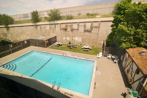 Community pool featuring a patio area