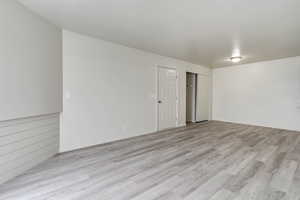 Empty room featuring light wood-type flooring
