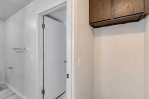 Bathroom with baseboards and light wood finished floors