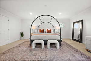 Carpeted bedroom featuring ornamental molding and recessed lighting