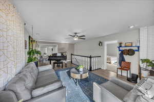 Living room with wood finished floors and ceiling fan