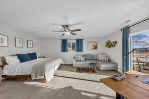 Bedroom featuring carpet floors and ceiling fan