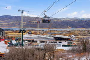 View of mountain backdrop featuring industrial structures