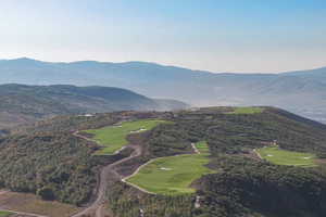 View of mountain background featuring a local golf course