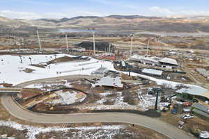Snowy aerial view featuring a mountain view