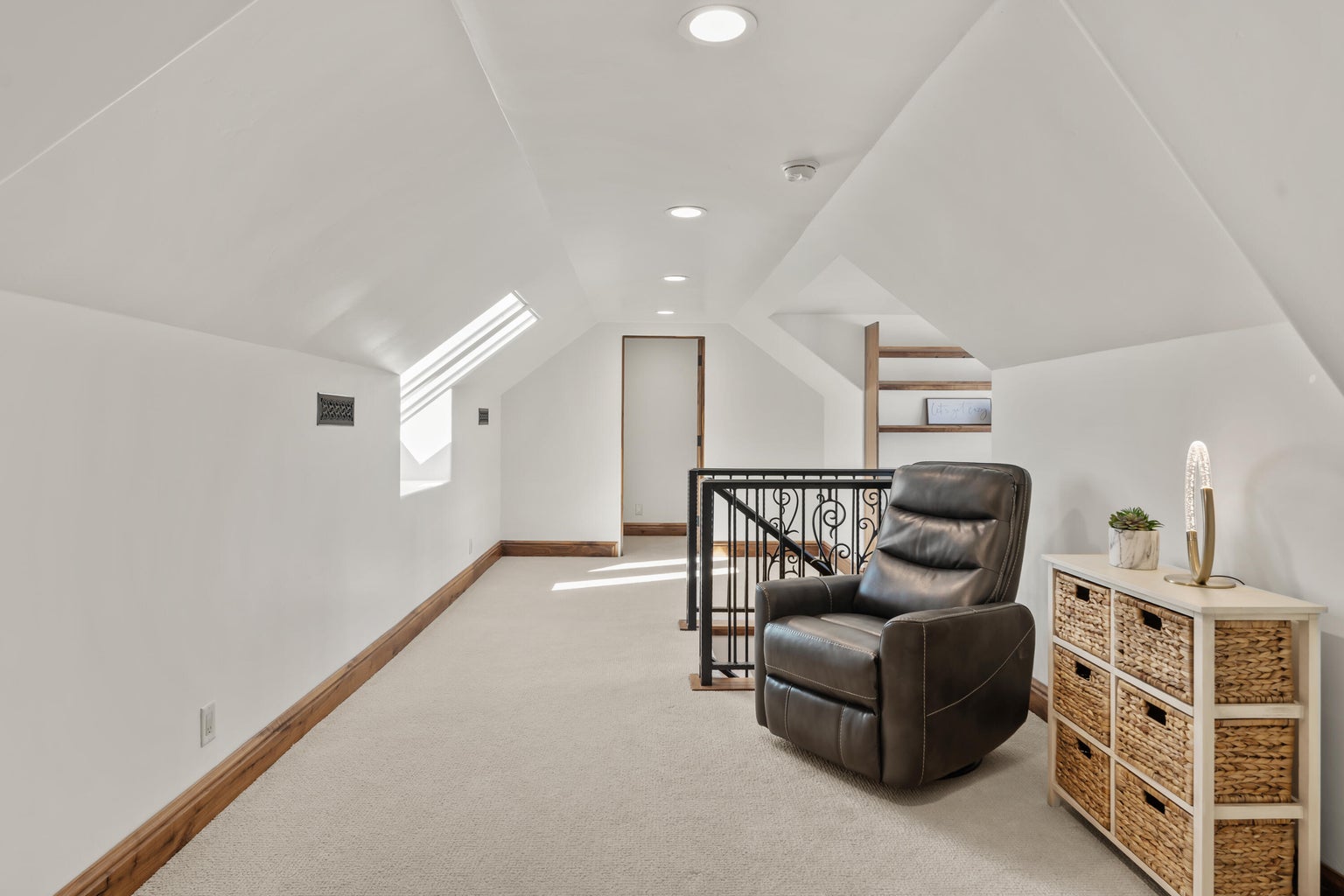 Loft area featuring lofted ceiling, recessed lighting, light carpet, and an upstairs landing