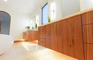 Walnut Floating Cabinets with under mounted LED lighting.