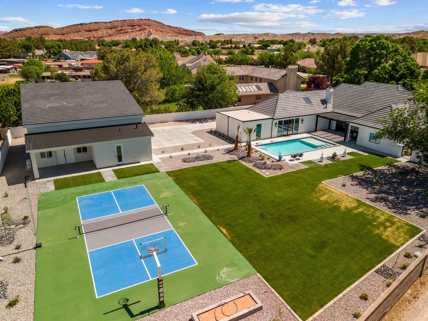 Drone / aerial view of a pool area and mountains