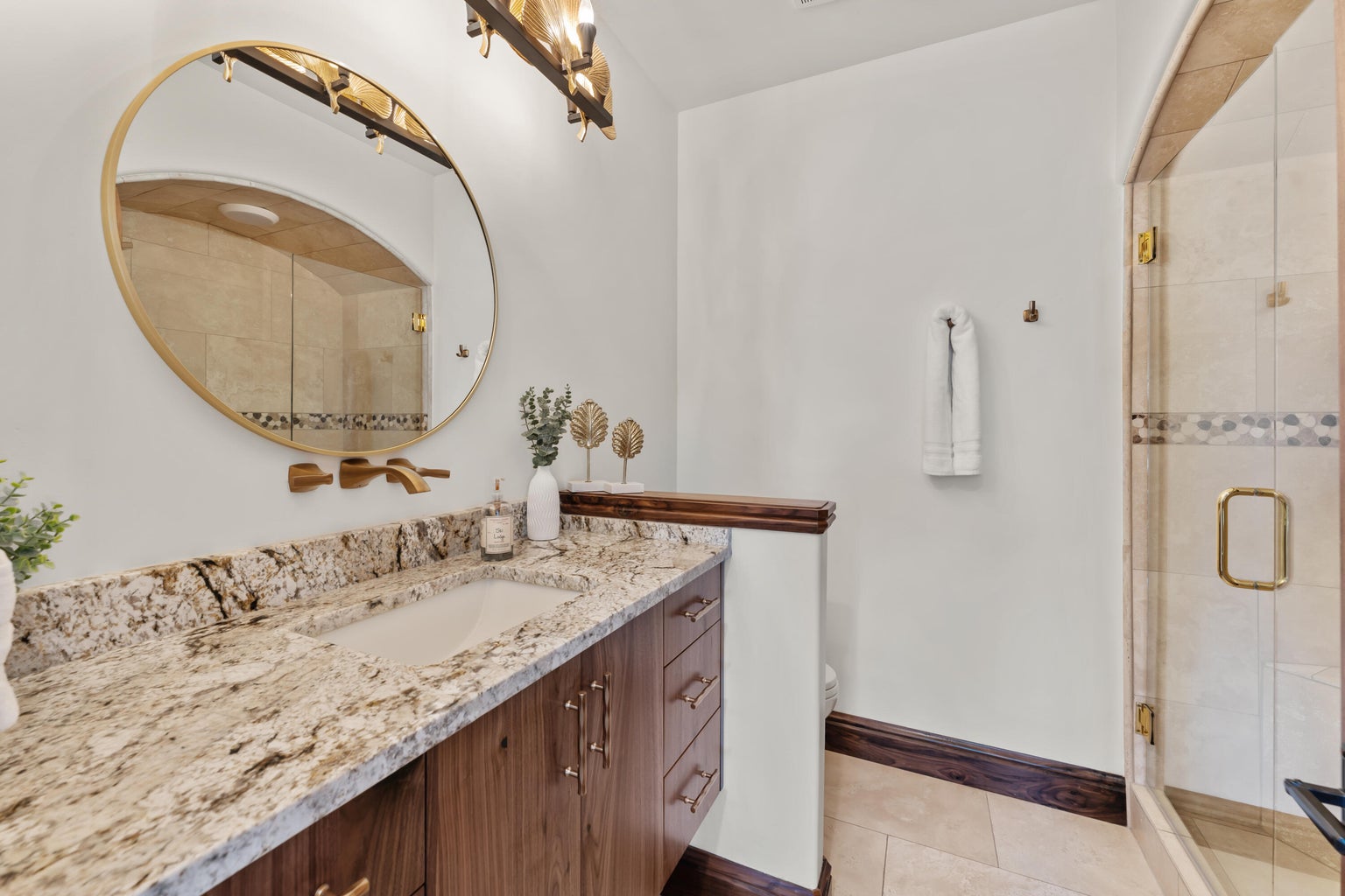 Full Guest bathroom #2 featuring vanity, a shower stall, and light tile patterned floors