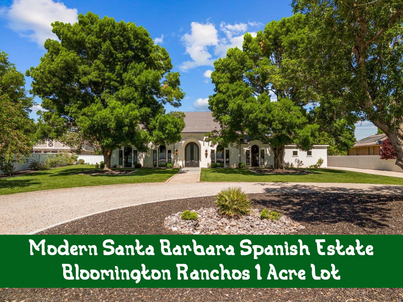View of property hidden behind natural elements featuring a front yard, a tile roof, and stucco siding