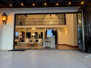 Entrance to property with a patio area and stucco siding