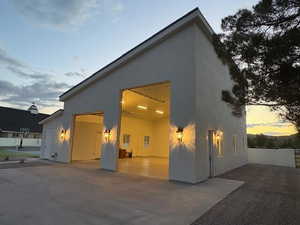 Back of property featuring stucco siding and a patio