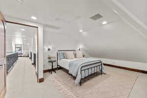 2nd Level Guest Bedroom featuring light carpet, recessed lighting, and lofted ceiling