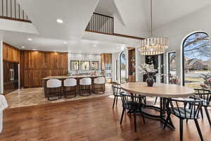Dining room featuring light wood-style floors and suspended lighting