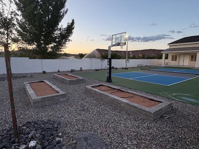 View of basketball court with garden area.