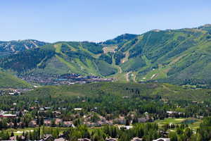 View of mountain backdrop with nearby suburban area