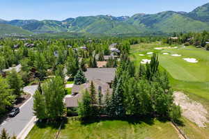 Drone / aerial view of mountains and a golf course