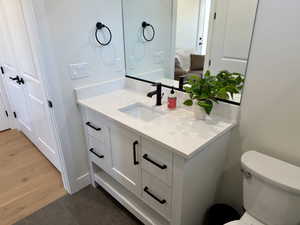 Bathroom with vanity and dark tile patterned flooring