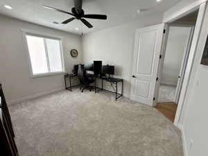 Office space with light colored carpet, recessed lighting, and a ceiling fan