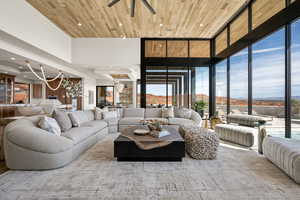 Living area featuring a mountain view, a high wood ceiling, recessed lighting, and ceiling fan