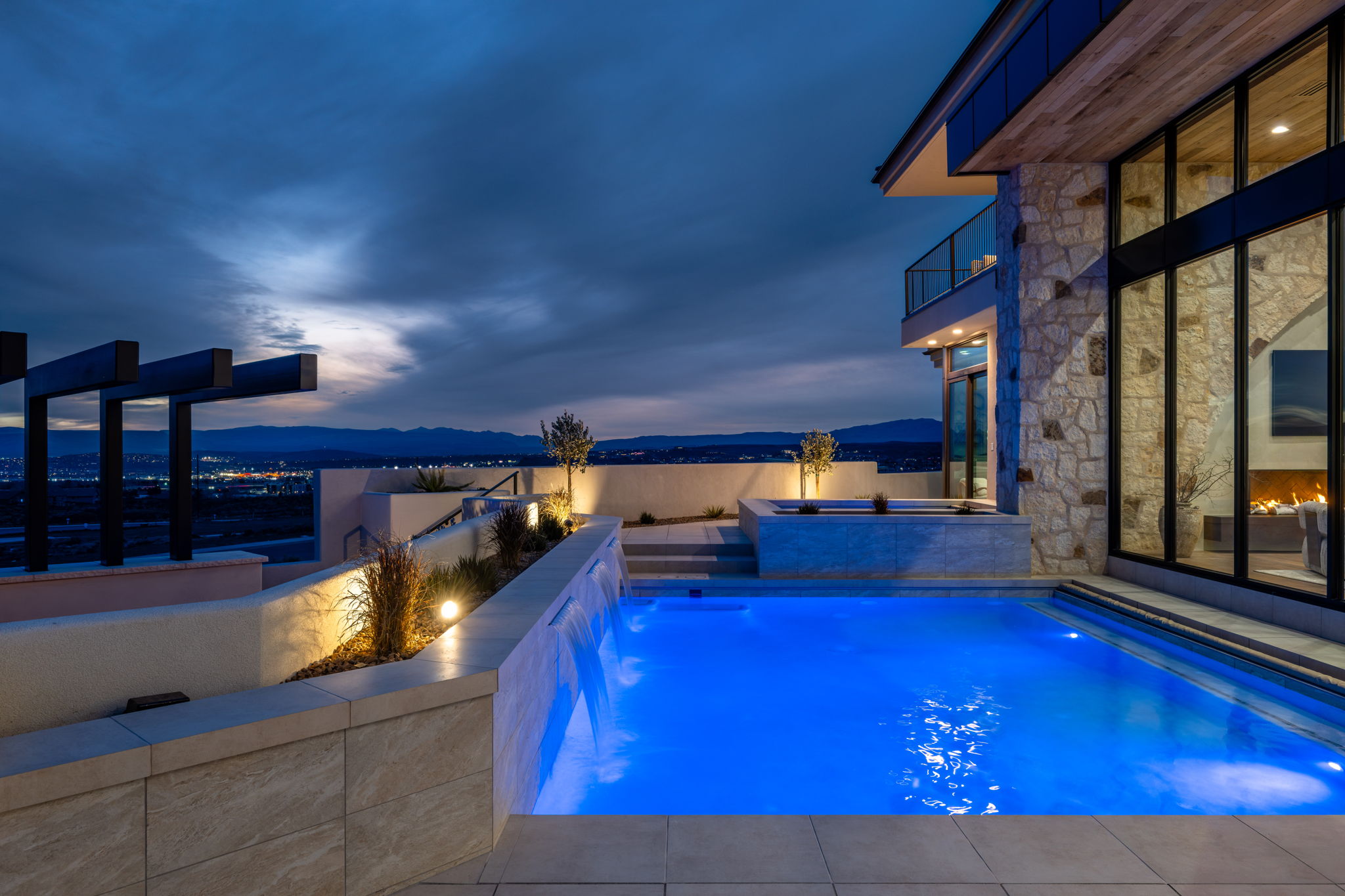 Relaxing pool / spa featuring a patio area and a mountain view